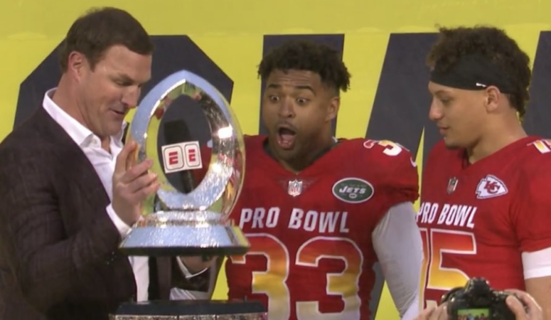 Jason Witten breaking the Pro Bowl trophy while simultaneously breaking his broadcast career. fantasy football